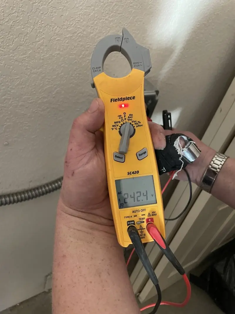 Voltage testing with clamp meter during Recessed Lighting Installation in Marlborough